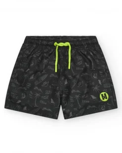 Bañador para niño en negro con estampado surfero y cordón flúor.
