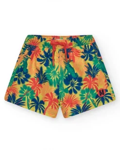 Bañador para niño multicolor con estampado tropical y cintura elástica.
