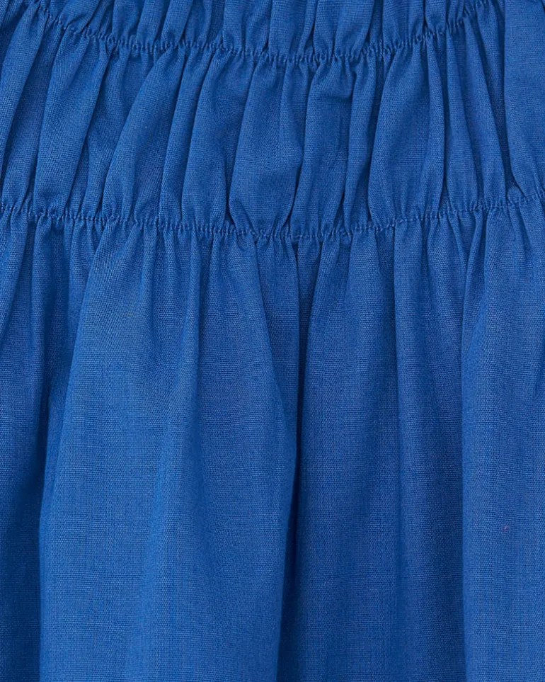Camisa para niña en azul con flores y fruncido