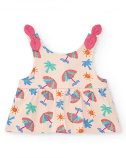 Conjunto crema para niña con blusa de paraguas y shorts rosa con volantes