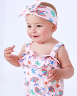 Diadema de punto para niña rosa con estampado tropical de palmeras y soles