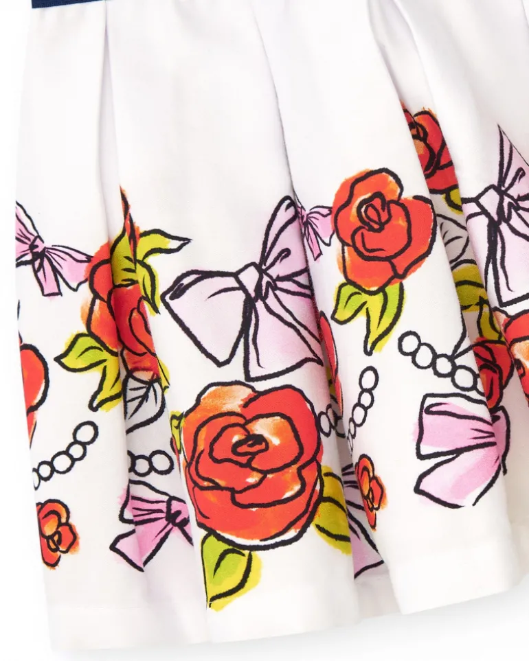 Falda blanca para niña con estampado floral y cintura elástica azul marino