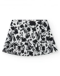 Falda para niña en blanco con estampado floral y volante