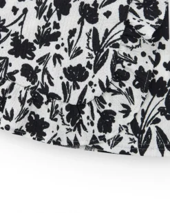 Falda para niña en blanco con estampado floral y volante